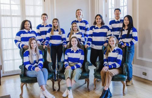 Trustee Scholars wearing white and blue striped shirts in Rosary Hall
