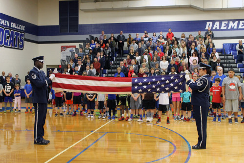 Soldiers folding American flag in Lumsden Gym