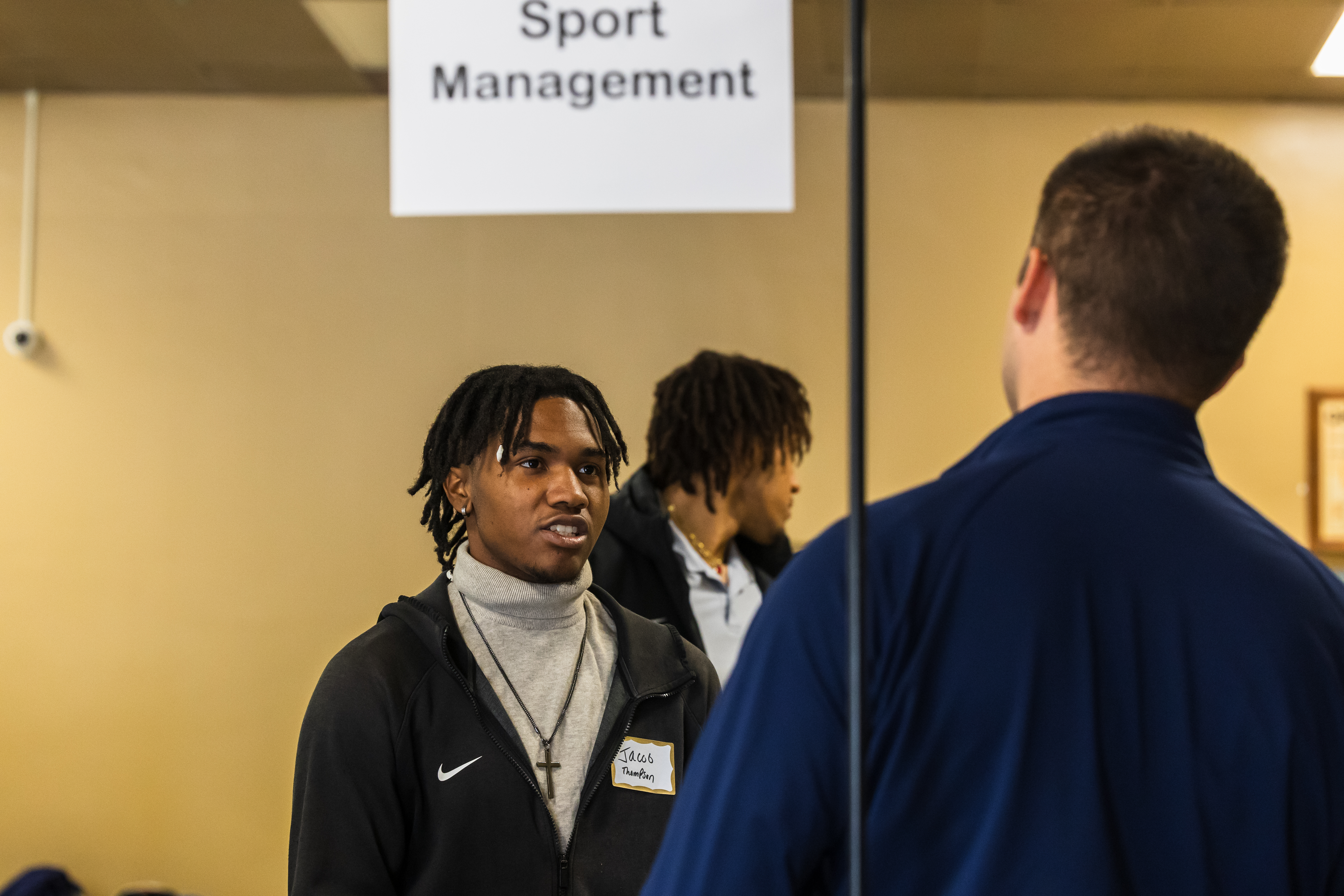 Students talking at Sport Management table