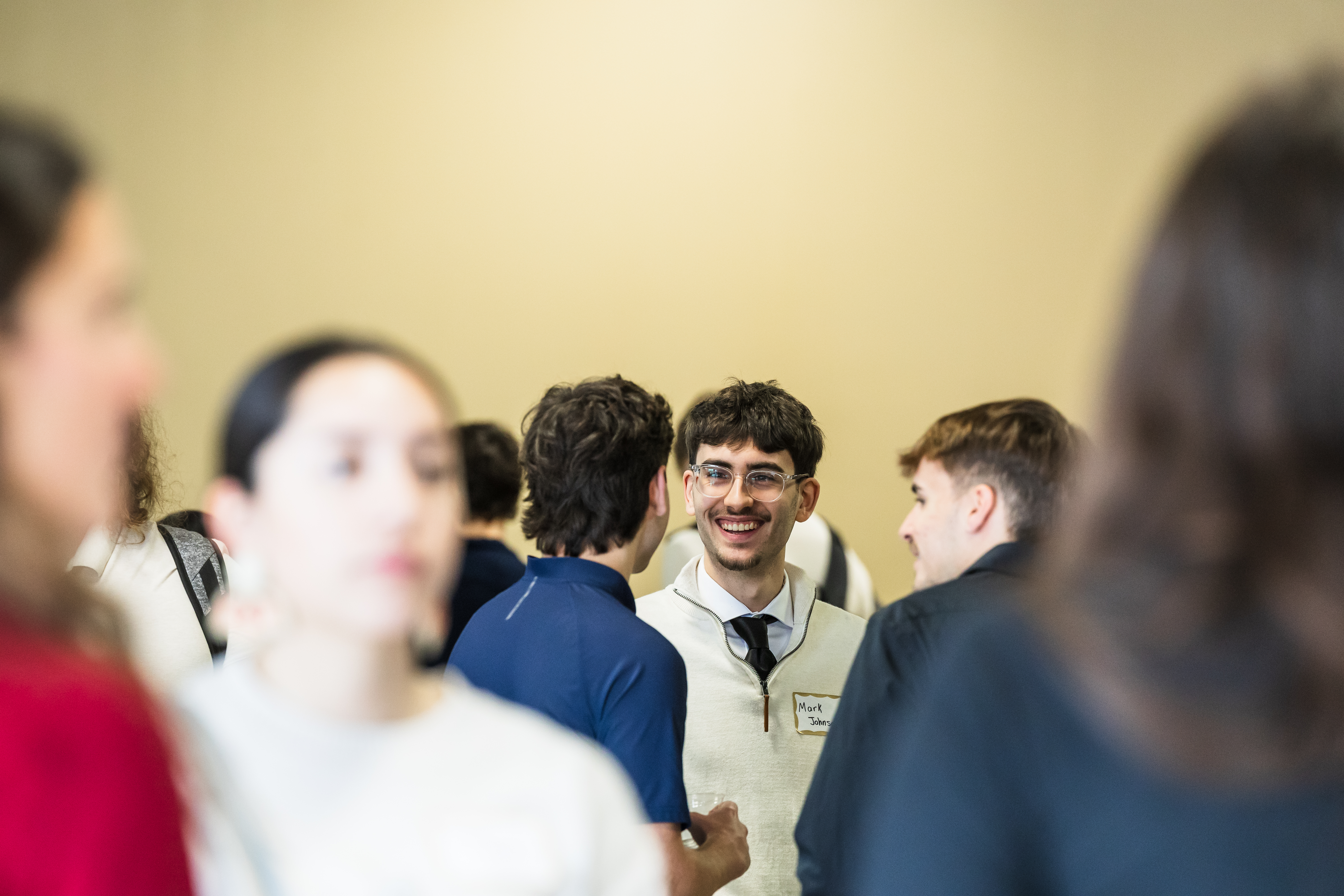 Group of students talking and smiling 