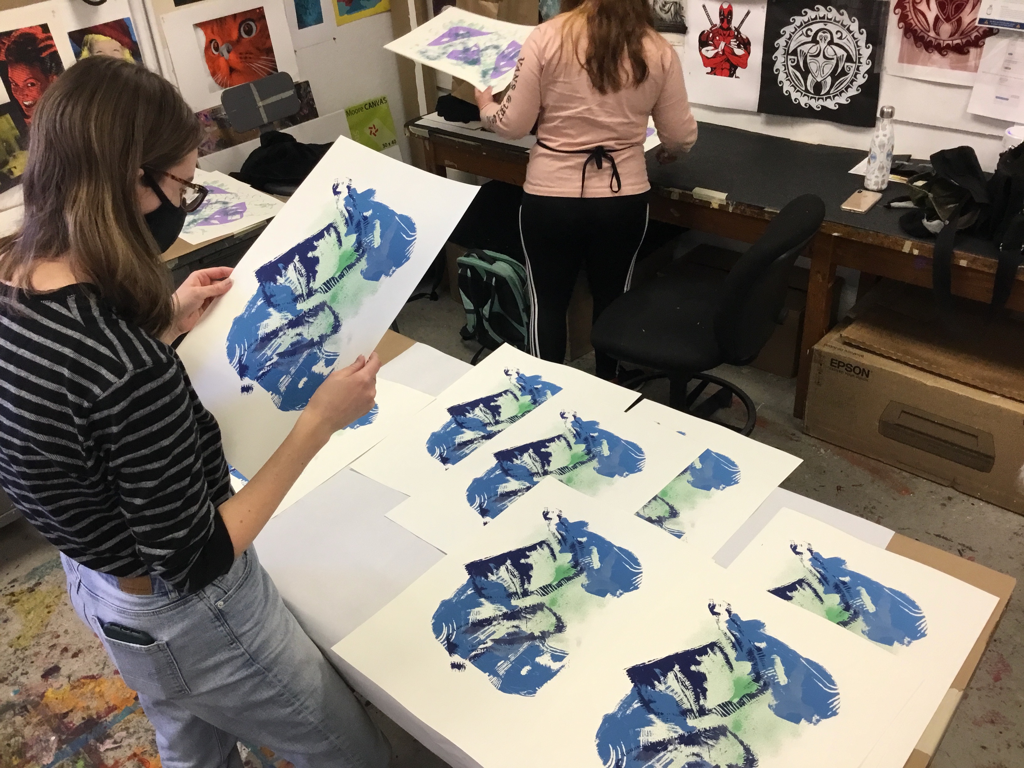 Heather Boehnke Inspecting an edition of 4-color prints in Serigraphy class