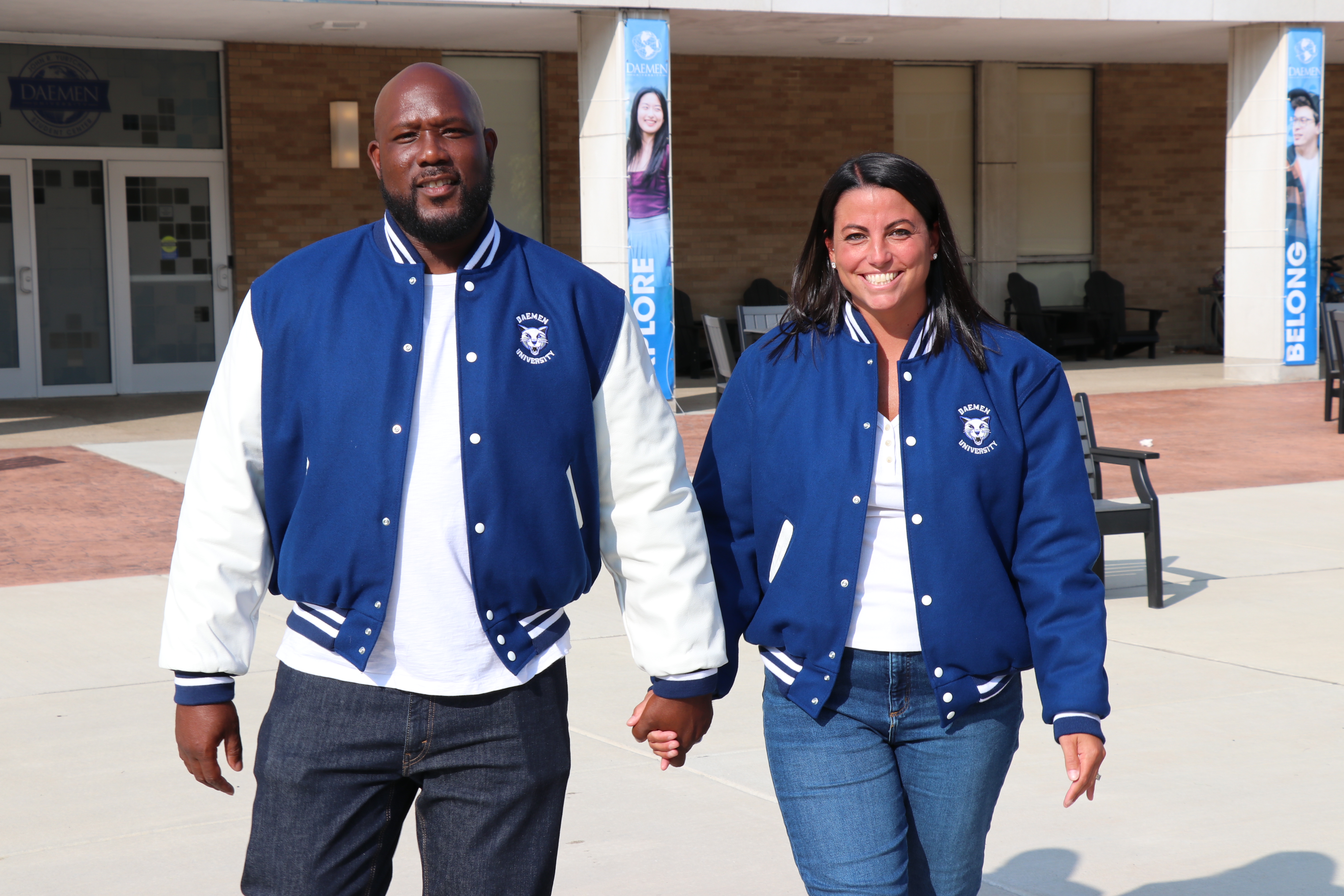 David and Bridget Burke walking from Yurtchuk student center