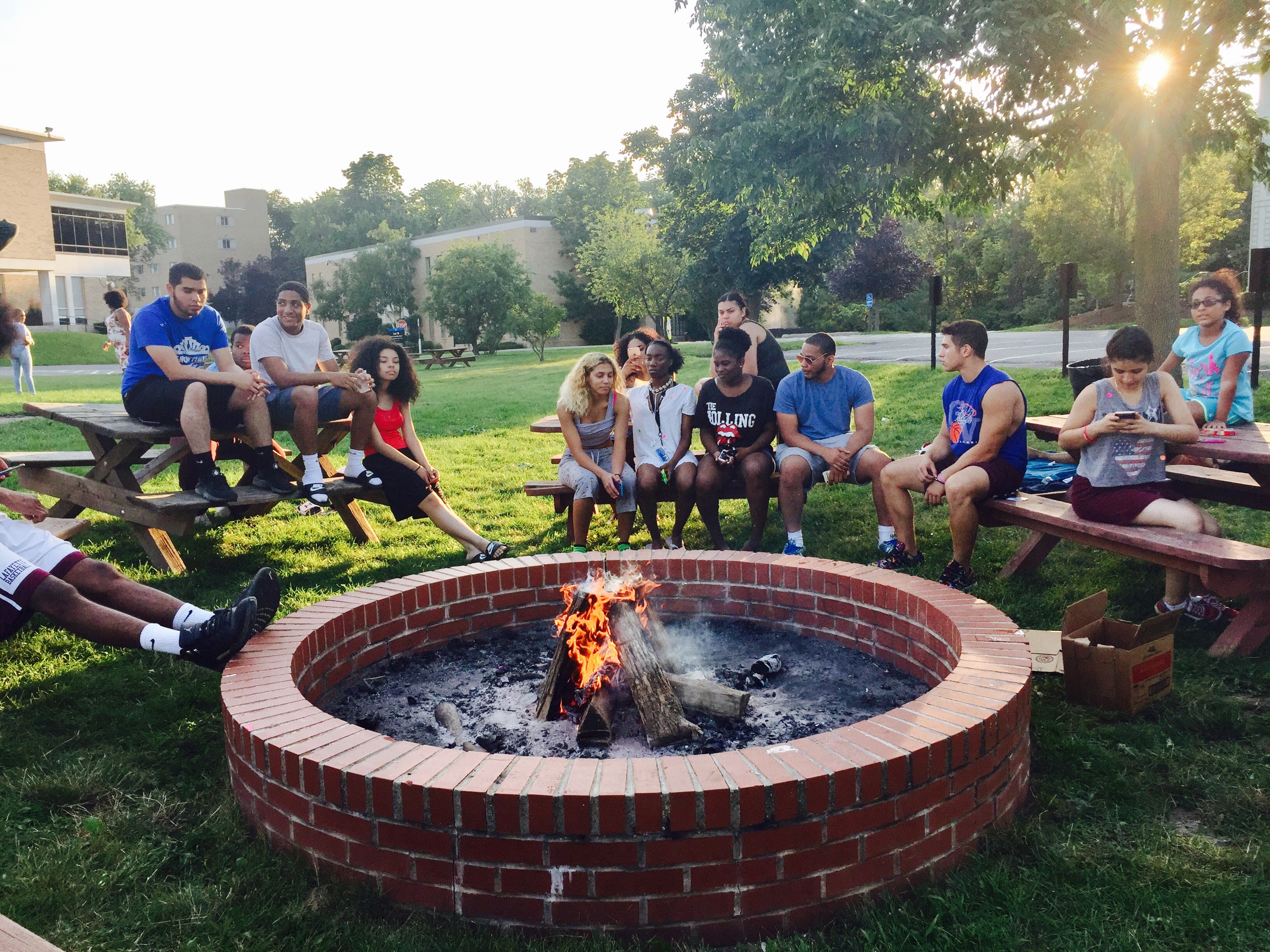 HEOP students enjoying time by the fire pit 