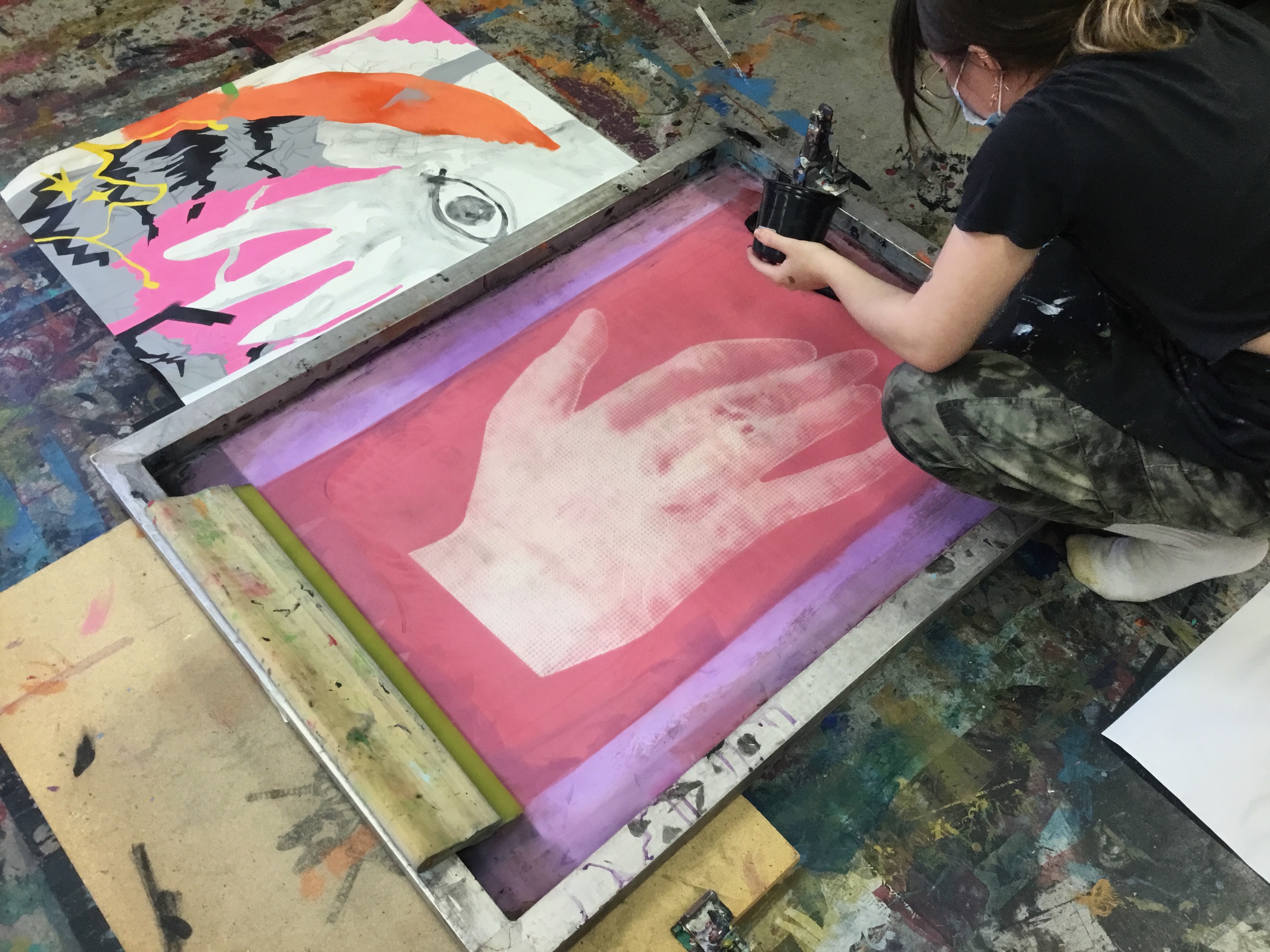 Julia Koprevich Preparing to screen print half-tone imagery onto canvas in Serigraphy II / Independent Study