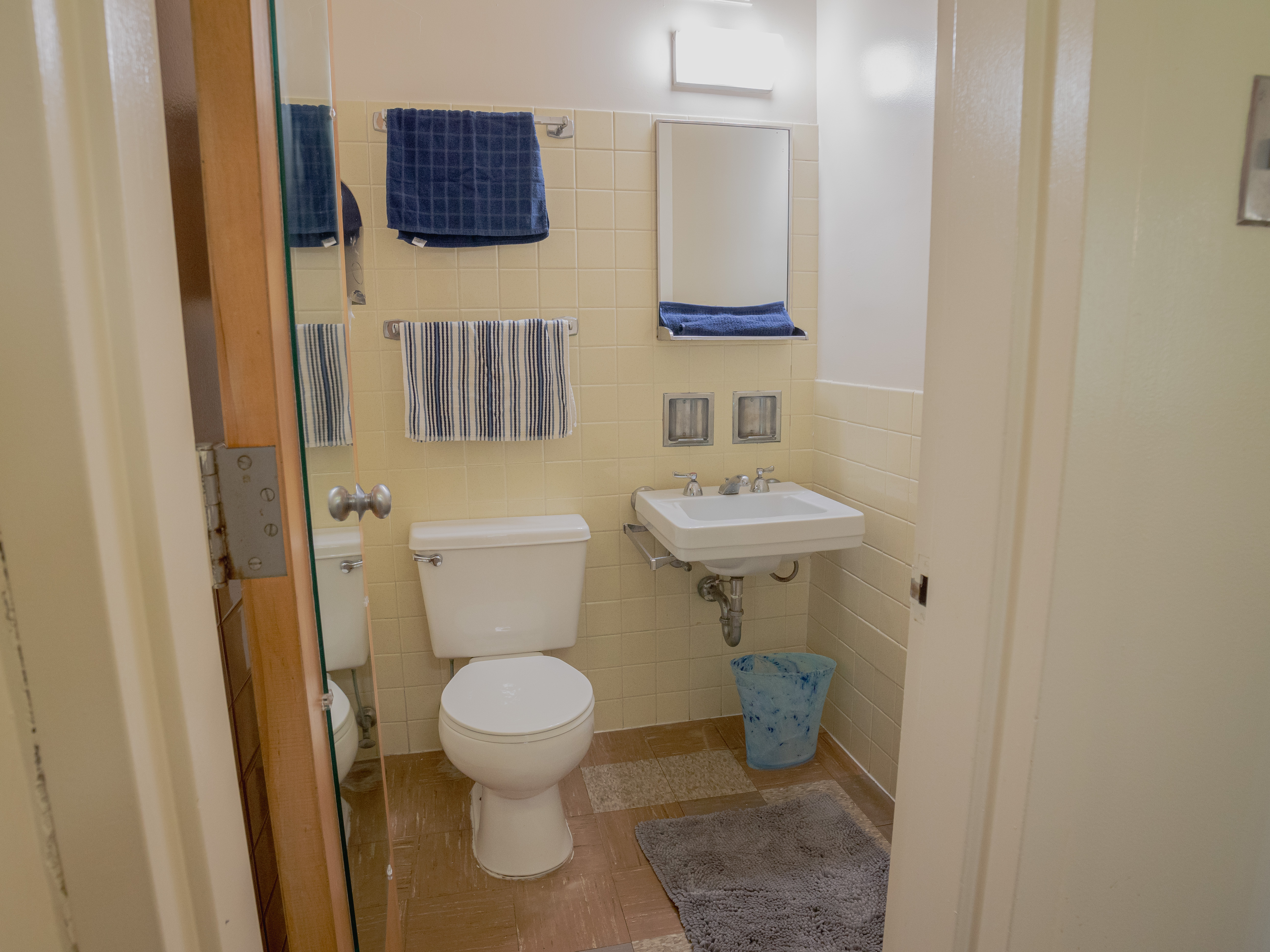Picture of Canavan Hall sink and toilet area in bathroom.