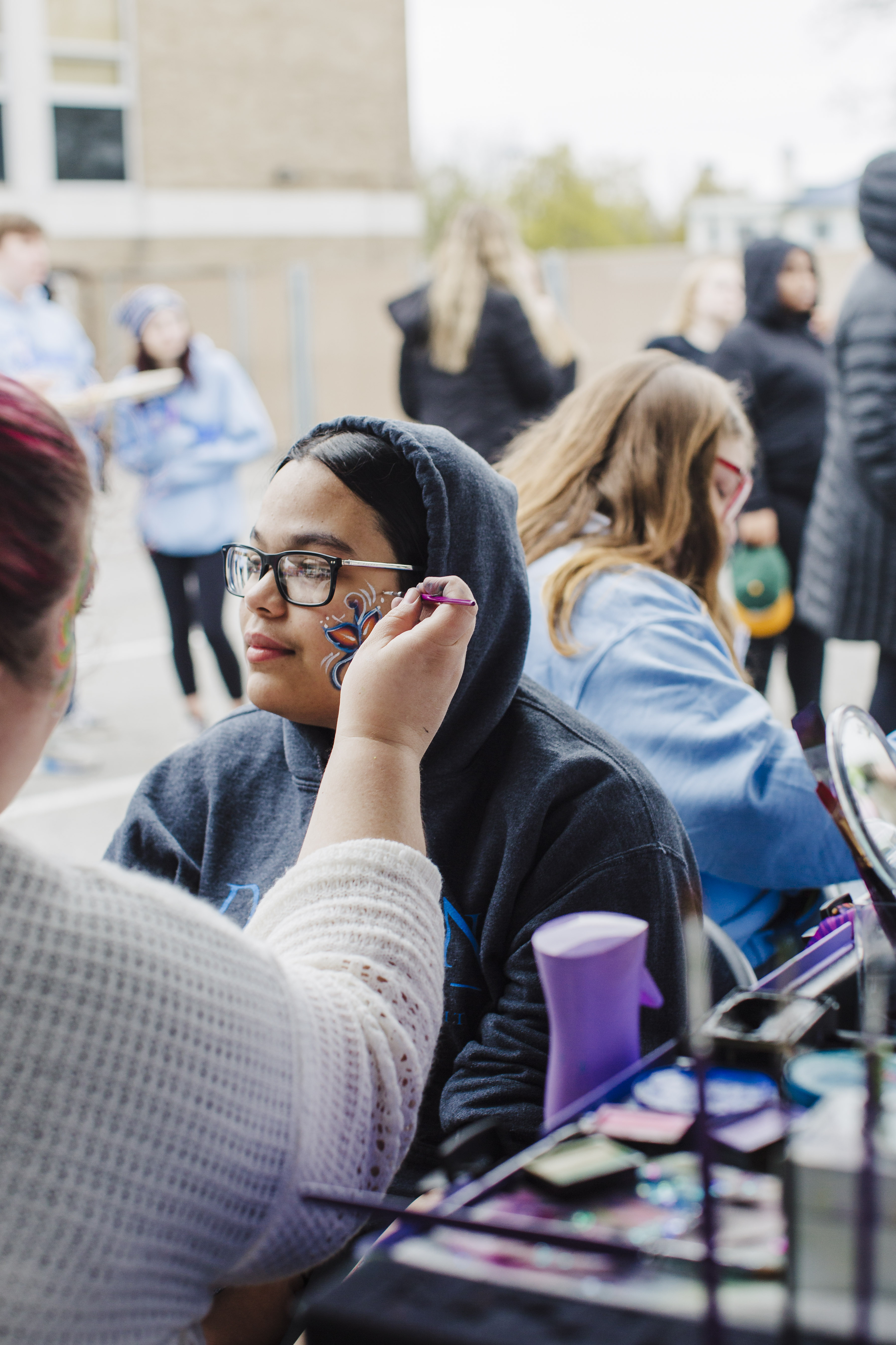 Student getting face painted during SpringFest carnival