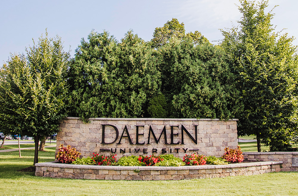 Daemen stone sign at main entrance at front of campus