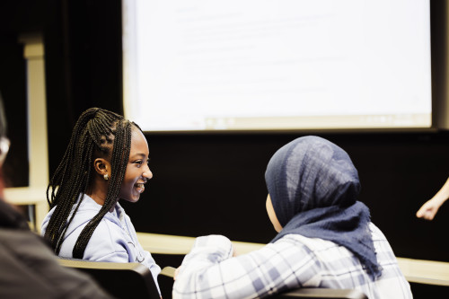 students talking in class