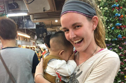 Monica Schubbe holding a baby in Thailand