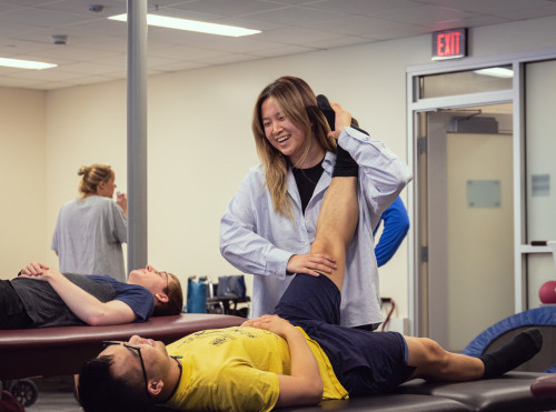 Student performing physical therapy