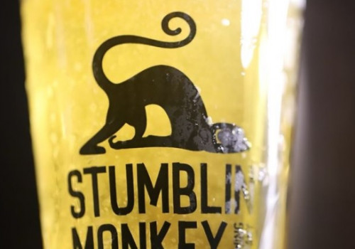 Stumblin Monkey Brewing Company glass with monkey on front