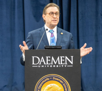 President Olson at podium delivery State of the University address