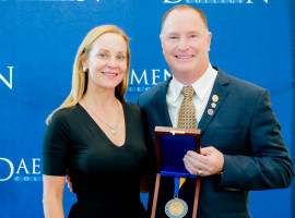 Dr. Shatkin and his wife holding the Presidential Medal